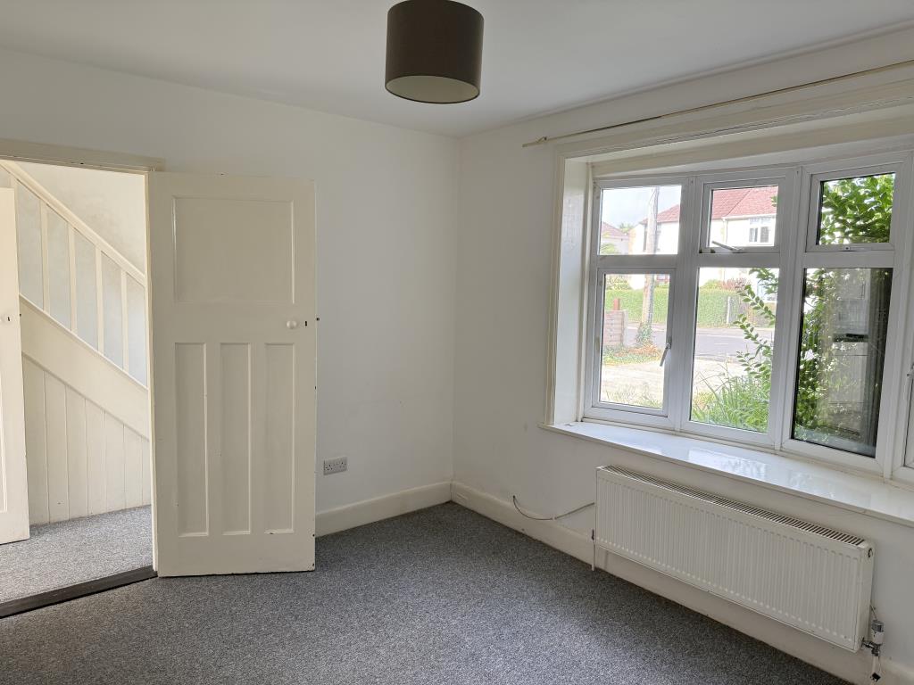 Lot: 124 - THREE-BEDROOM SEMI-DETACHED HOUSE - Living room with bay window and view of front garden